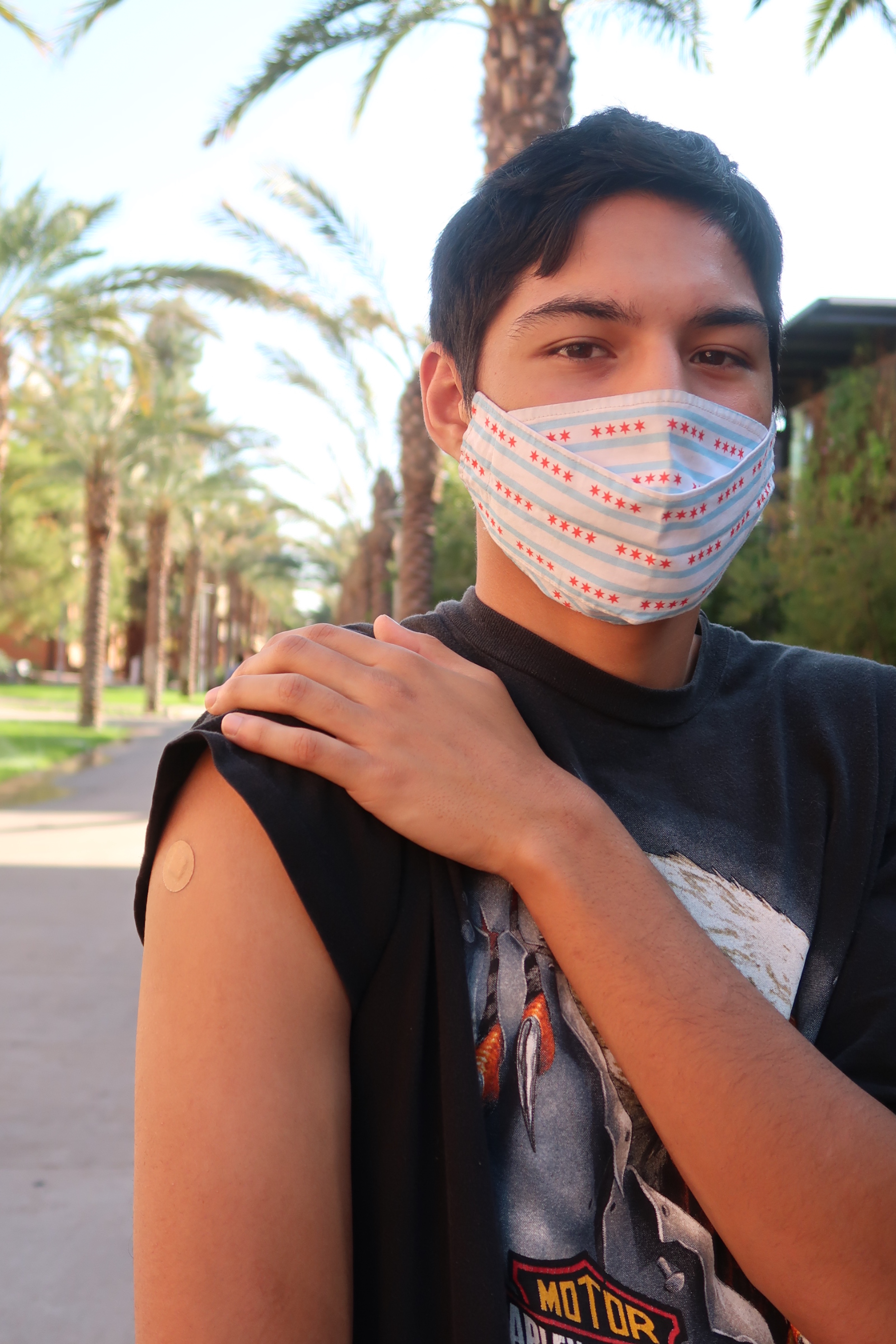 Arizona State Student shows off his flu shot from health services. 