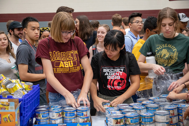 ASU students sort cans at a community service event for Changemaker Central at Arizona State University in Tempe