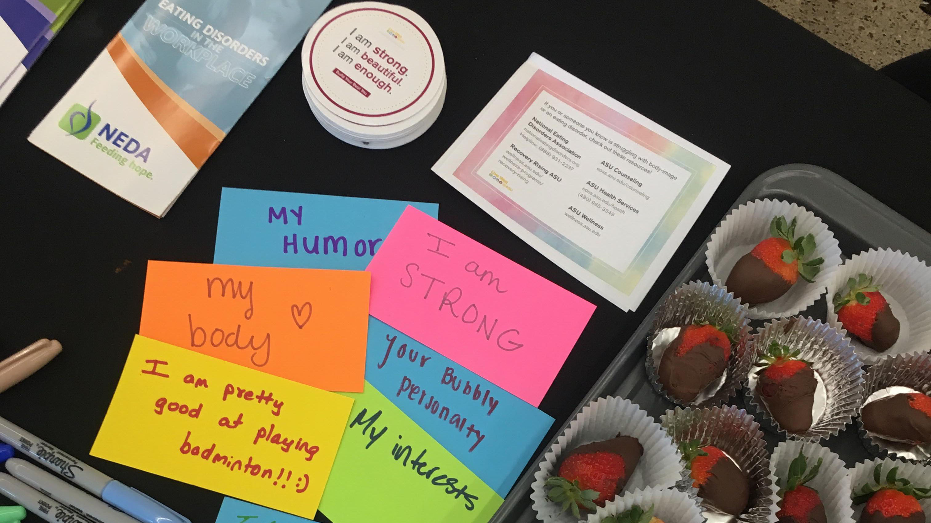 Affirming messages written on post-it notes such as "i am enough" for an ASU event about eating disorder awareness