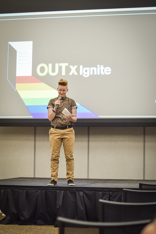 A student onstage at ASU's OUTxIgnite storytelling event for Fall Pride Week 2019