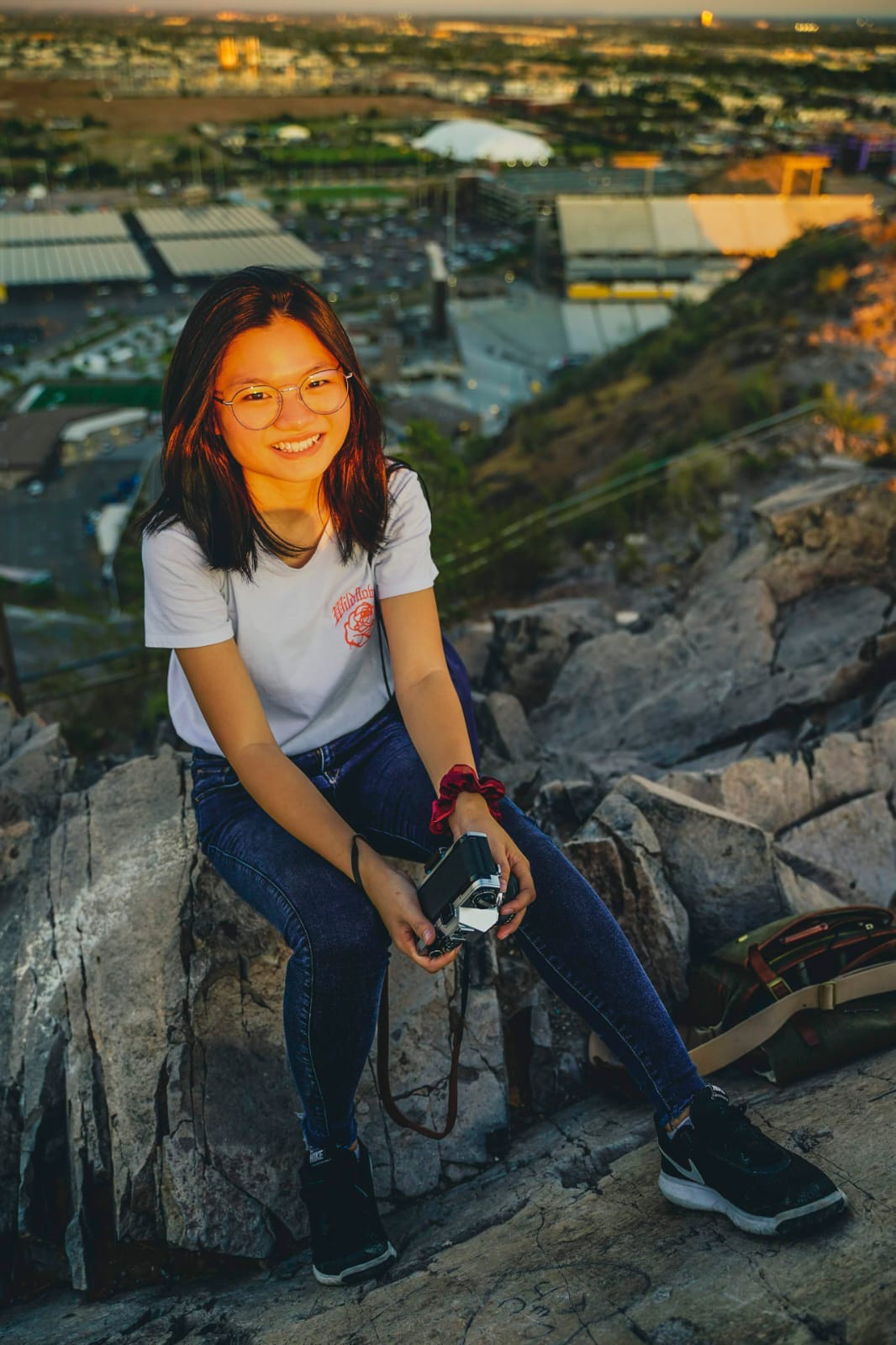 Yvonne Chook, a third-year student studying biomedical engineering, smiles on top of A Mountain. 
